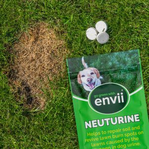 Envii Neuturine packet and tablets laid on grass by side of dog urine burn brown spot